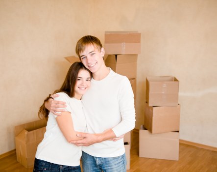 Careful loading of boxes and furniture by a man with van