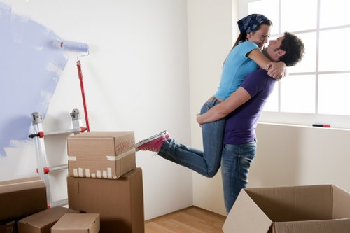 Staff using careful lifting techniques during a removal job