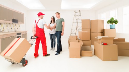 Commercial moving team unloading business items at a new premises