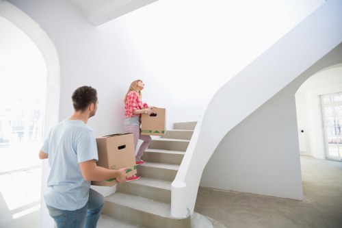 Family moving furniture with a removal van in Orpington