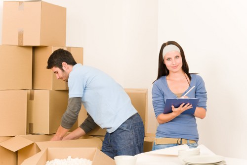 Office move team organising boxes and workstations